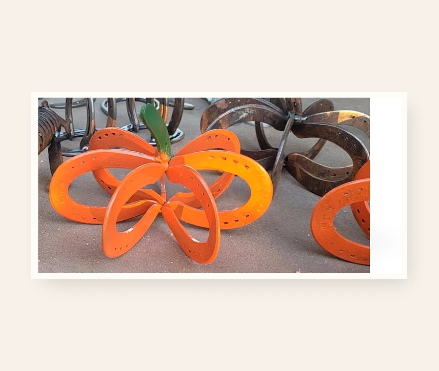 Orange horseshoe pumpkin welded by Addison